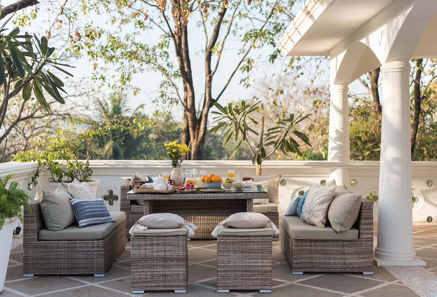 outdoor patio with brown wicker furniture sofa set